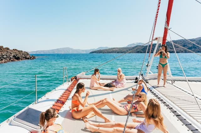 Santorini: Catamaran Tour with BBQ Dinner, Drinks, and Music