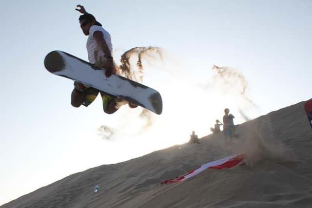 Sandboarding in the Concon Dunes
