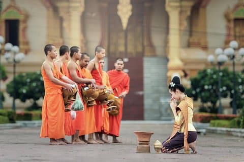 Sunrise blessing walk towards famous temple with fruit and flower donation