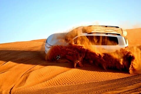 Morning Desert Safari with Sandboard and Camel Ride