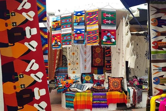 Otavalo Market & Peguche Falls Tour with Bizcochos – From Quito