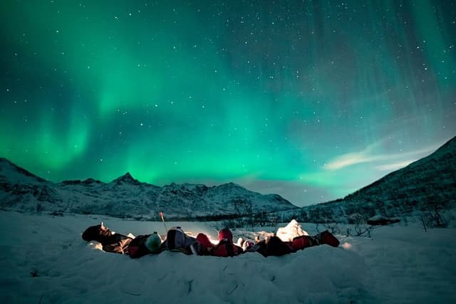 Tromso Aurora Hunt with Bonfire, Meal, Winter Suit & Photos