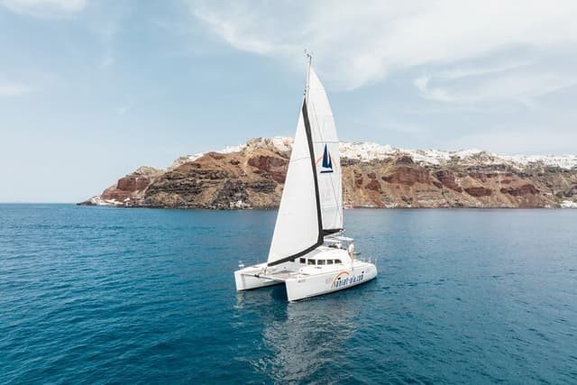 Private Morning Tour Lagoon 400-380 Sailing in Santorini ,lunch, drink, transfer