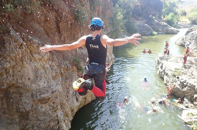 From Mijas: Guadalmina Canyon Canyoning Tour