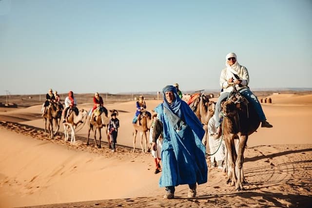 Overnight desert camp experience : camel ride & Sandboarding