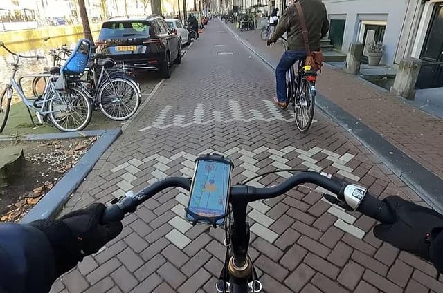 Amsterdam on Bicycle GPS App Walking Tour Mobile Game