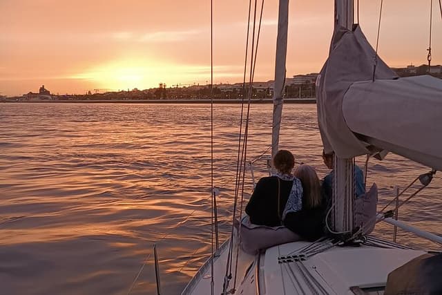 Sunset sailing boat trip in Lisbon with snacks