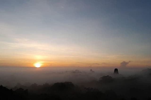 From Flowers Sunrise in Tikal and Sunset in Yaxha in a day
