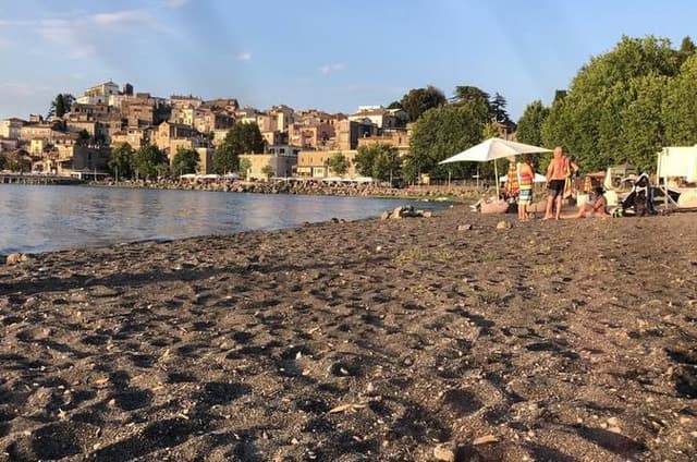 Discover Anguillara Village Lake Boat Tour and Sunset Swim