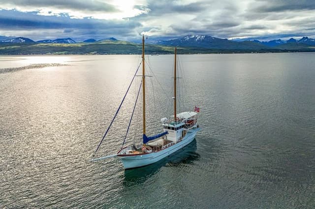 Tromsø Midnight Sun Yacht Cruise with a meal and optional Hot Tub