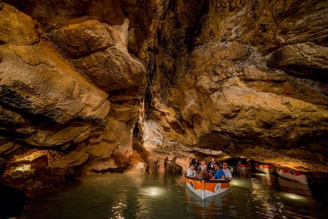 Unveil Valencia's Secrets: Caves of San José Boat Adventure