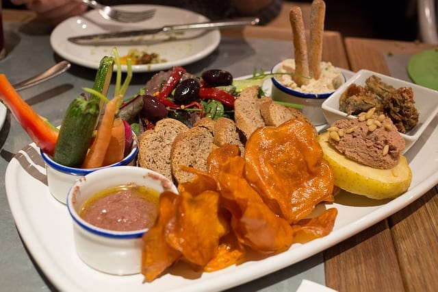 a platter of an assortment of spanish bite-sized tapas delicacies