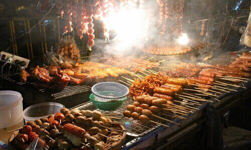 Grilled meats and skewers at a local market in Koh Samui. 