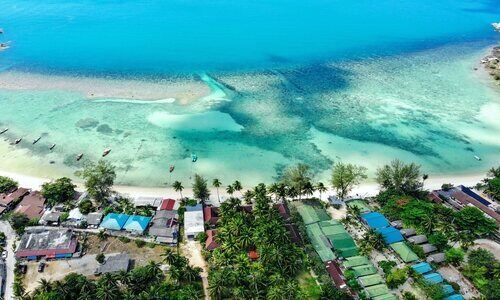 Aerial view of Koh Phangan's clear blue waters. 