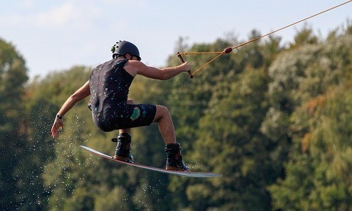 A wakeboarder performing a mid-air stunt