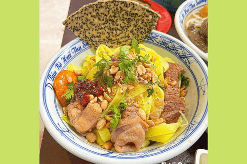 Delicious bowl of golden-noodled Quang noodles