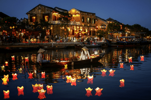 Float lotus flower lanterns into the Hoai River