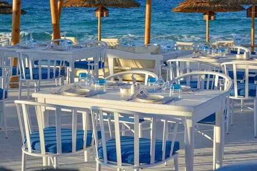 Picture of tables at the Greek Club in Alexandria Egypt and the sea is in the background