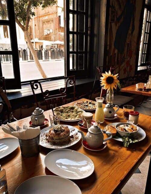 A picture of the view in Eish + Malh in Cairo, Egypt restaurant along with some dishes they serve 