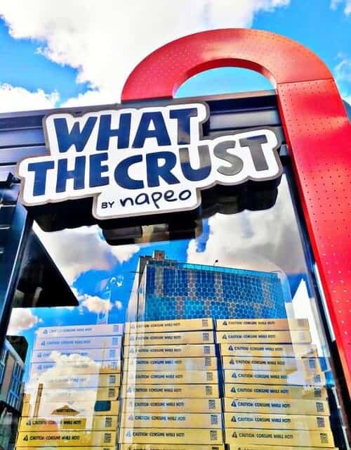 A picture of the sign of What the Crust restaurant in Cairo, Egypt.