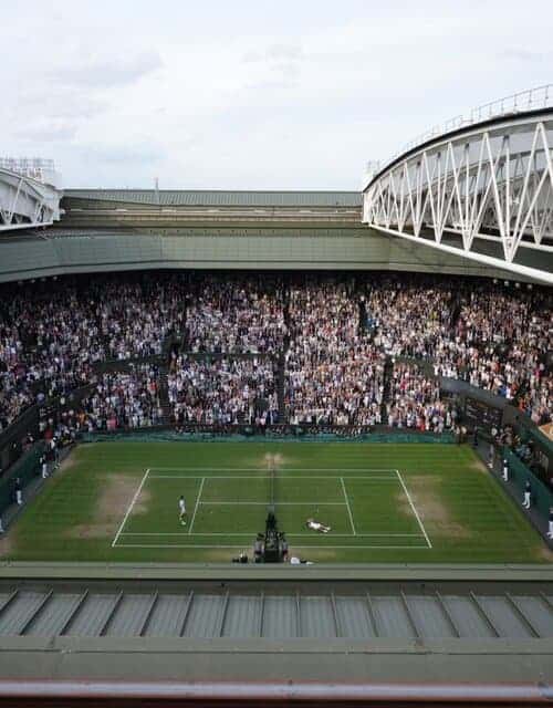 A picture of a tennis match at Wimbledon in London.