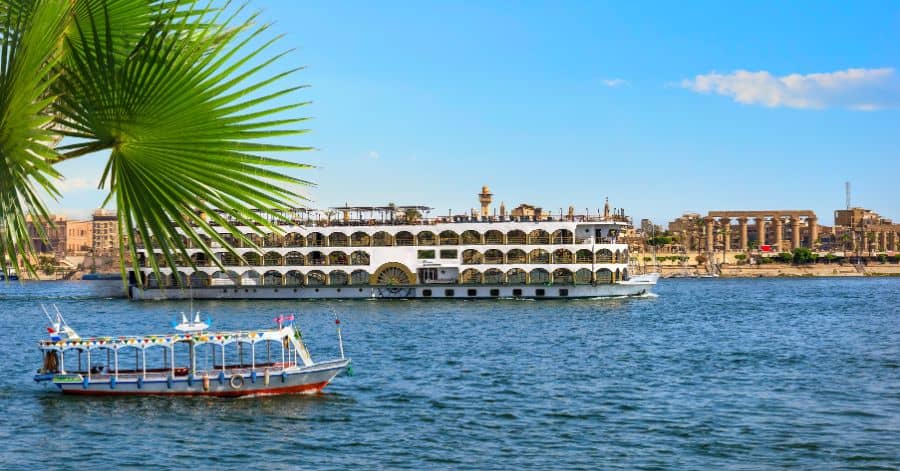 A picture taken of the Nile in Luxor, Egypt while boats are passing by.