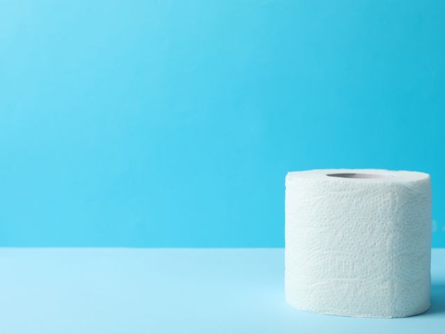 A picture of toilet paper with a blue and light blue background.