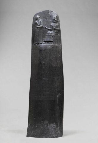 A picture of Law Code of Hammurabi inside of the Louvre Museum in Paris, France.