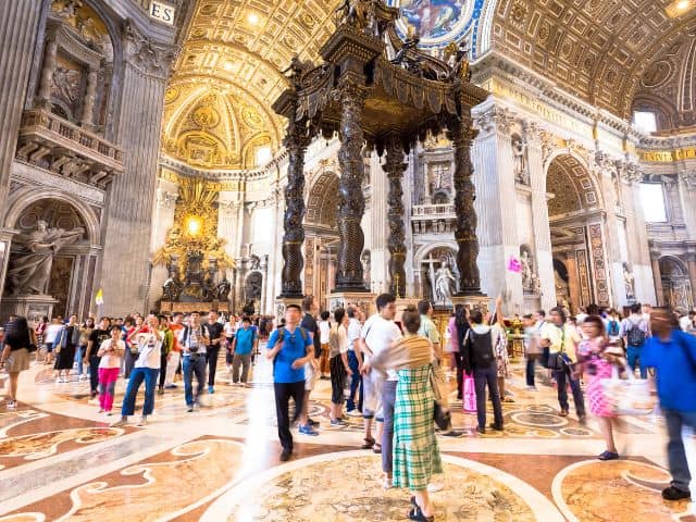 A picture showing an example of overtourism in St. Peter's Basilica.