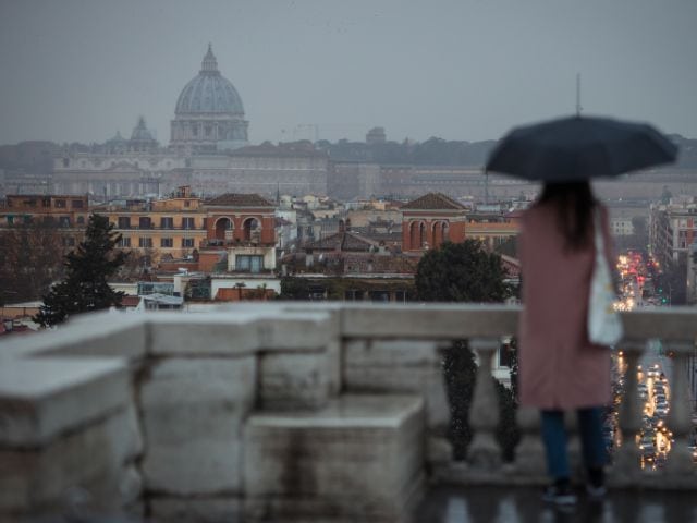 A picture of a woman alone in Rome.