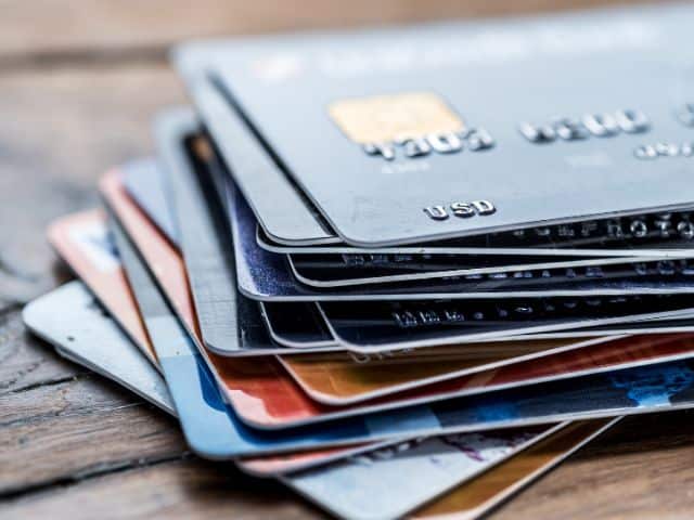 A picture of several credit cards on top of each other.