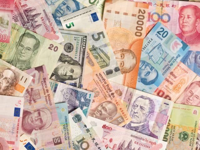 A picture of several international currencies. 