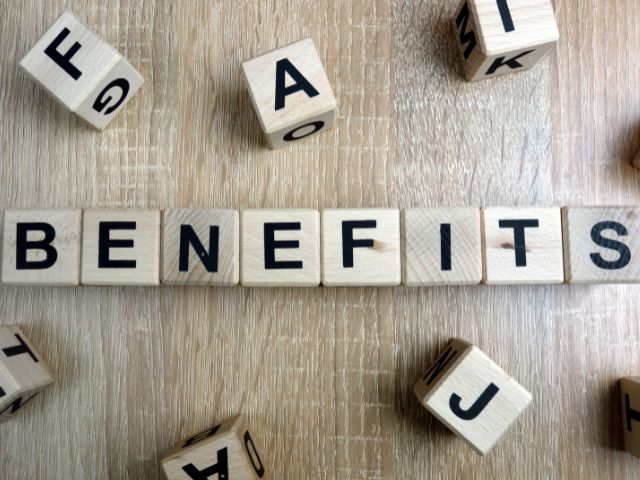 A picture of the word benefits written on wooden blocks.