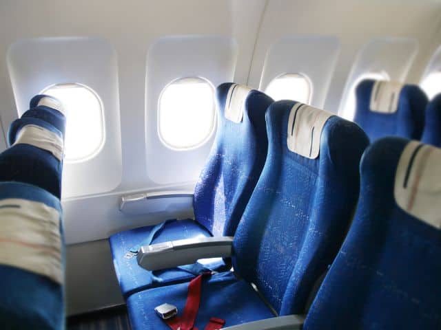 A picture of a row of seats in an airplane.