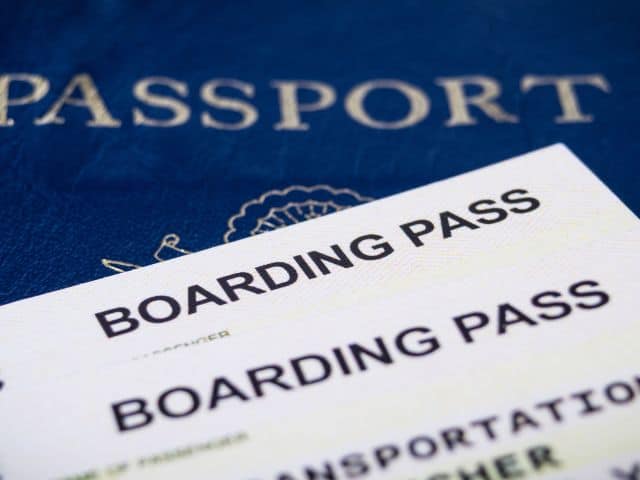 A picture of booking passes on top of a passport.