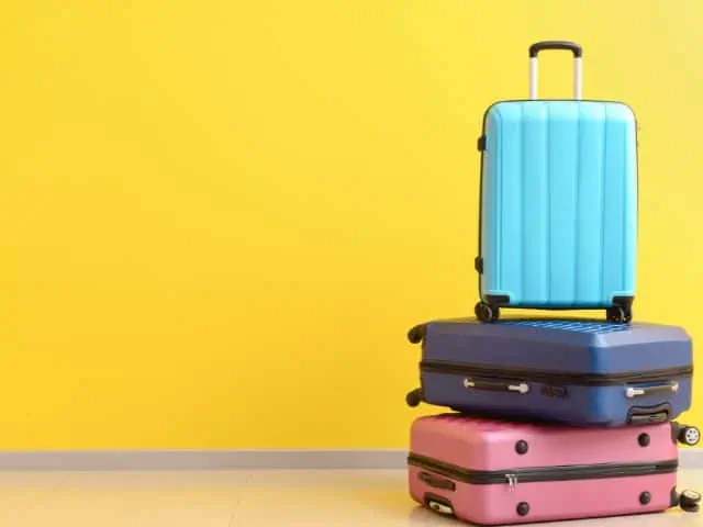 A picture of several suitcases on top of each other.