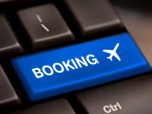 A picture of the word "booking" written on a keyboard key.