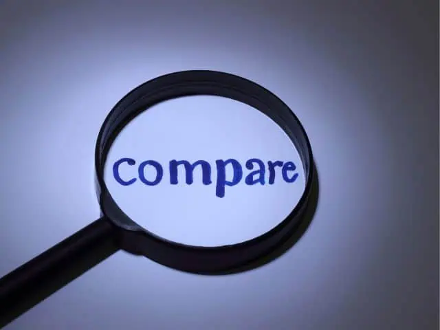 A picture of the word "compare" under a magnifying glass.