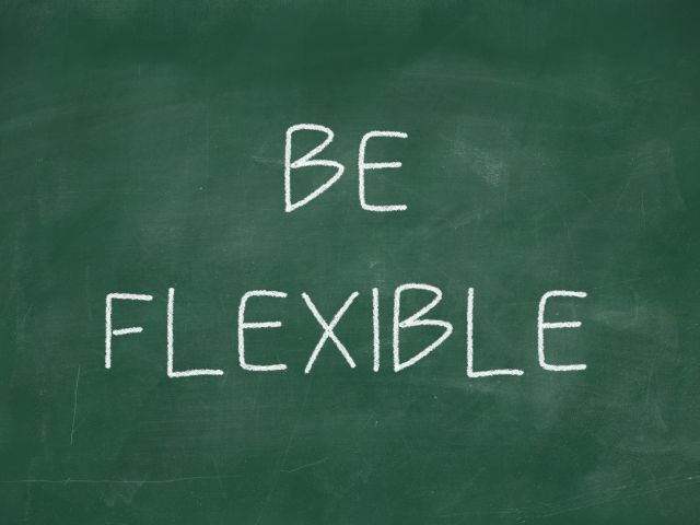 A picture of the words "Be Flexible" written on a blackboard.