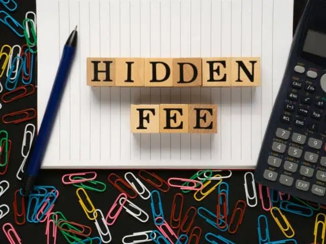 A picture of the words "hidden fees" written on hidden blocks.