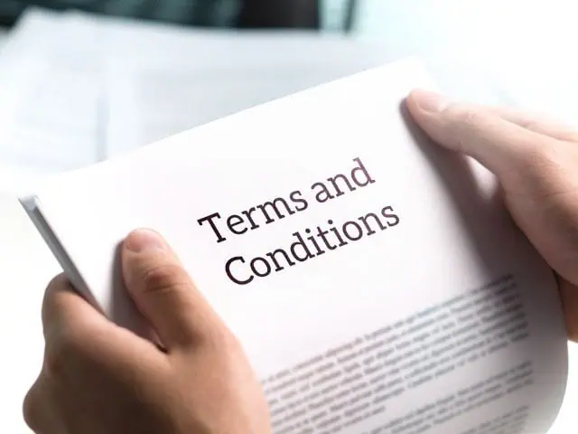 A picture of the words "terms and conditions" written on a document.